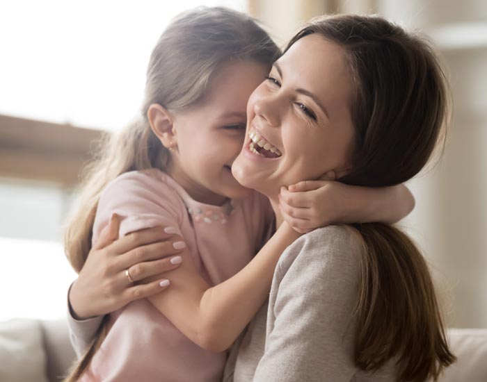 daughter and mother laughing