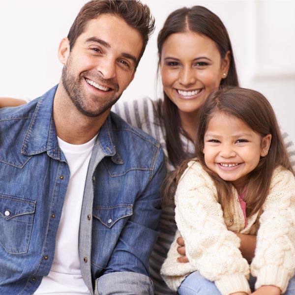 Smiling Family of Three